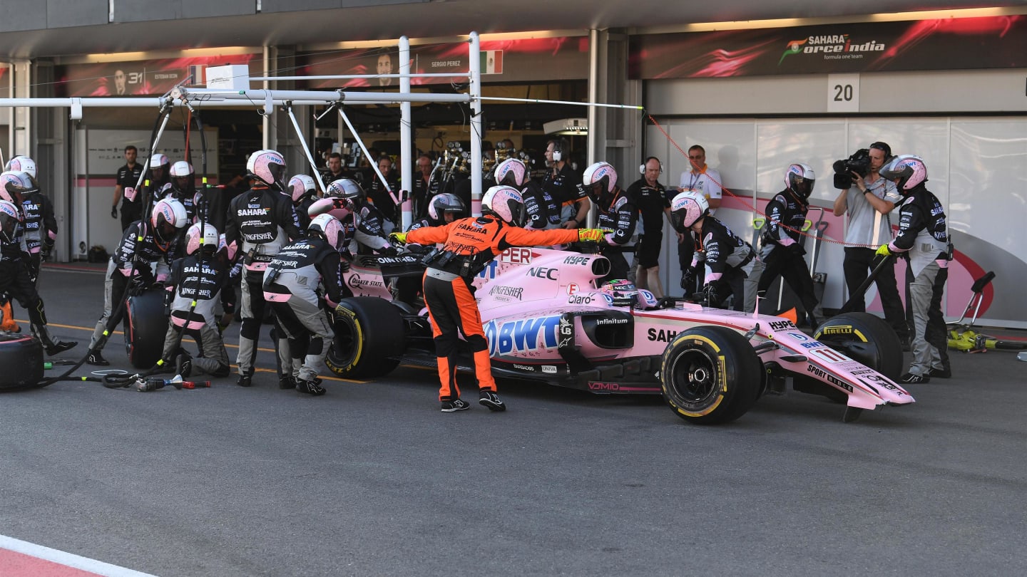 Sergio Perez (MEX) Force India VJM10 pits with a broken front wing at Formula One World