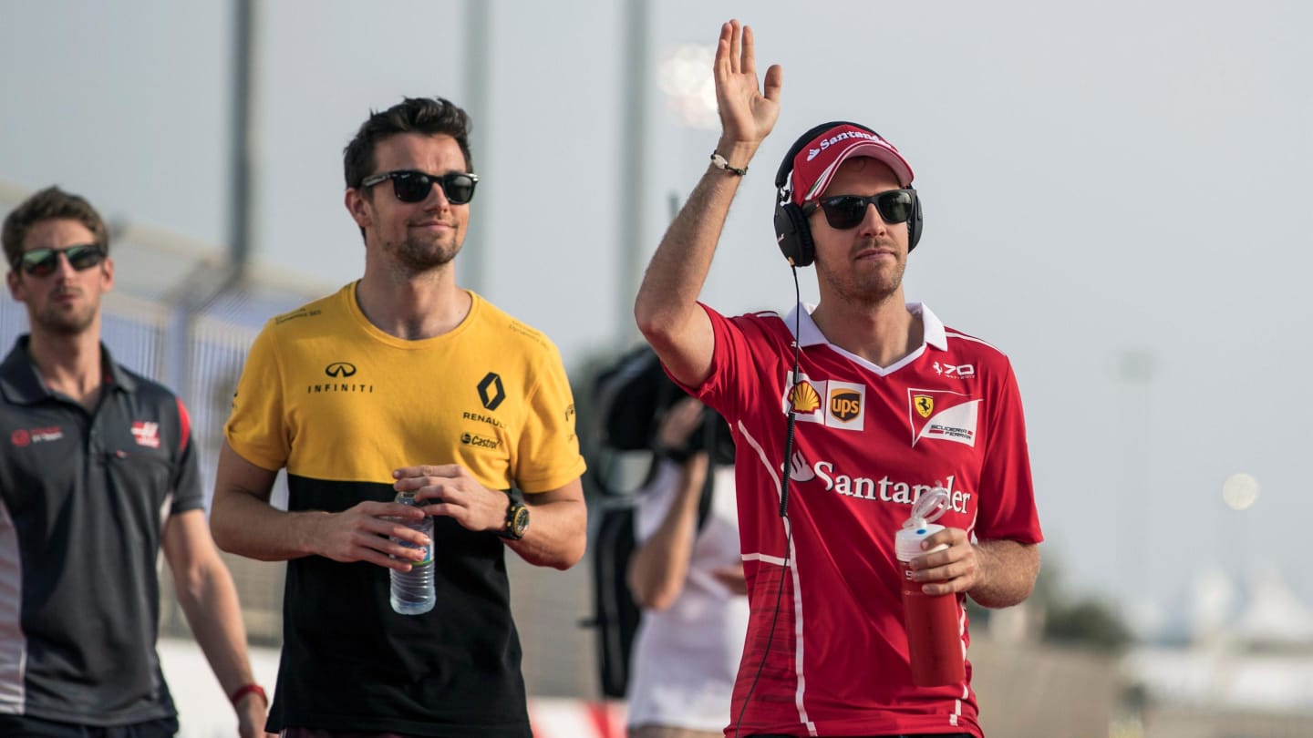 Sebastian Vettel (GER) Ferrari and Jolyon Palmer (GBR) Renault Sport F1 Team on the drivers parade at Formula One World Championship, Bahrain Grand Prix Race, Bahrain International Circuit, Sakhir, Bahrain, Sunday 16 April 2017. © Sutton Motorsport Images