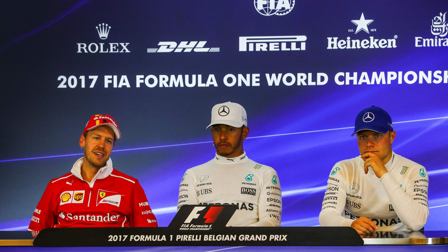 Sebastian Vettel (GER) Ferrari, Lewis Hamilton (GBR) Mercedes AMG F1 and Valtteri Bottas (FIN)