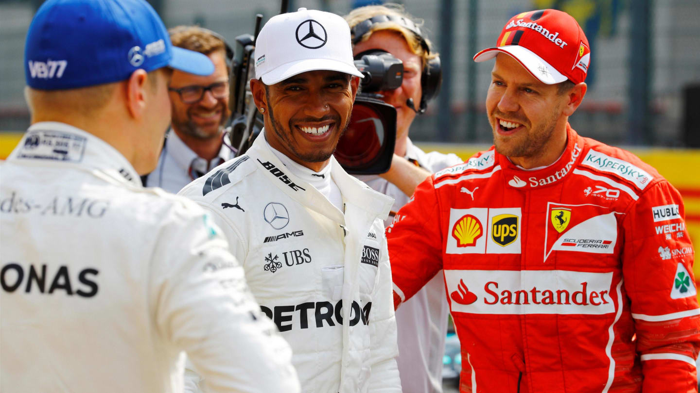 Pole sitter Lewis Hamilton (GBR) Mercedes AMG F1 celebrates in parc ferme with Sebastian Vettel