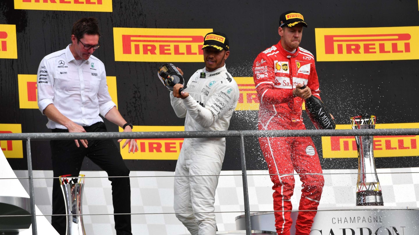Lewis Hamilton (GBR) Mercedes AMG F1 celebrates on the podium with Sebastian Vettel (GER) Ferrari, Andy Shovlin (GBR) Mercedes AMG F1 Engineer and the champagne at Formula One World Championship, Rd12, Belgian Grand Prix, Race, Spa Francorchamps, Belgium, Sunday 27 August 2017. © Sutton Images