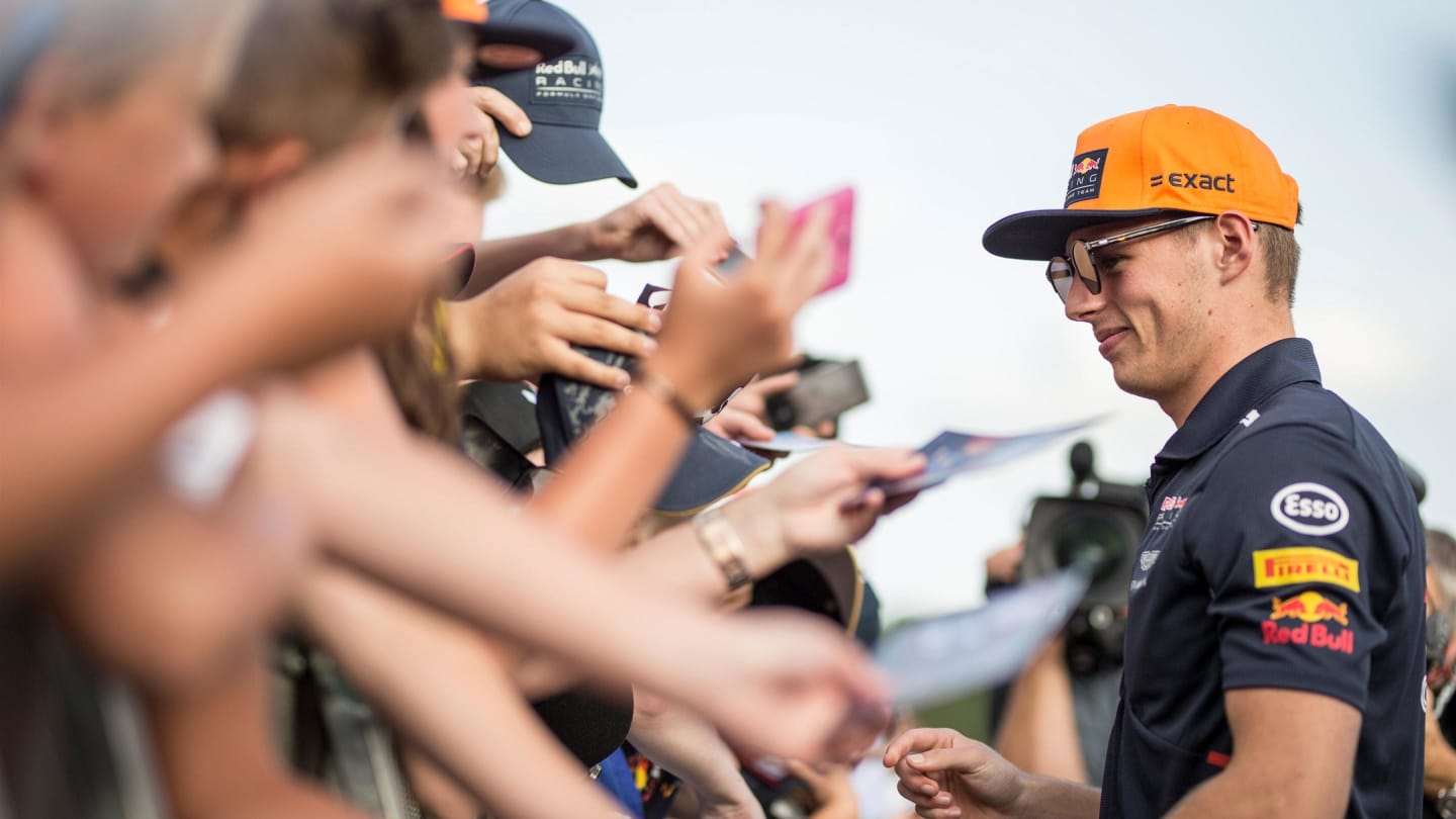 Max Verstappen (NED) Red Bull Racing signs autographs for the fans at Formula One World