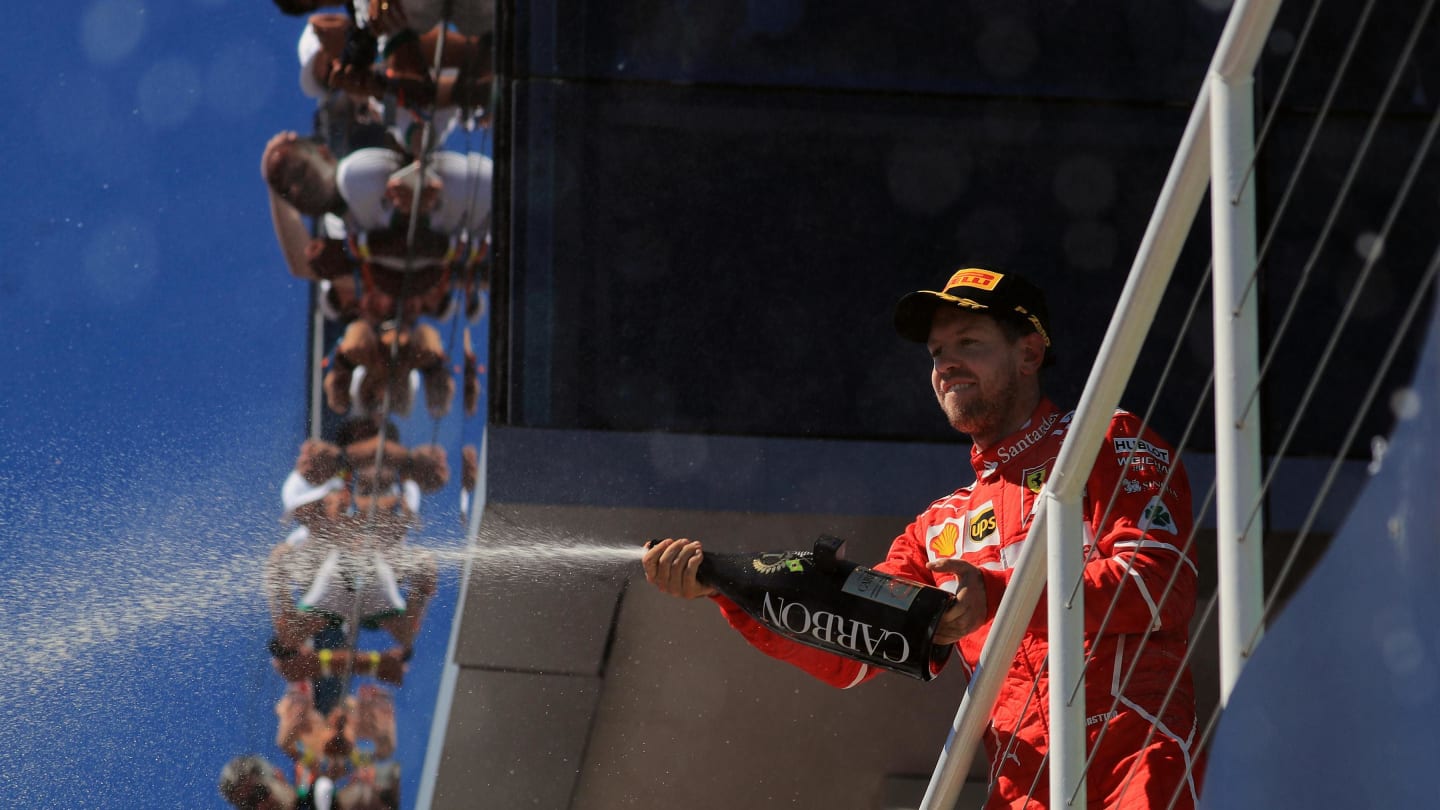 Race winner Sebastian Vettel (GER) Ferrari celebrates on the podium with the champagne at Formula One World Championship, Rd19, Brazilian Grand Prix, Race, Interlagos, Sao Paulo, Brazil, Sunday 12 November 2017. © Kym Illman/Sutton Images