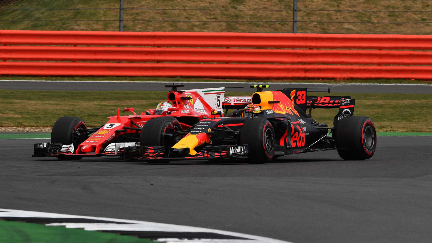 Max Verstappen (NED) Red Bull Racing RB13 and Sebastian Vettel (GER) Ferrari SF70-H battle at
