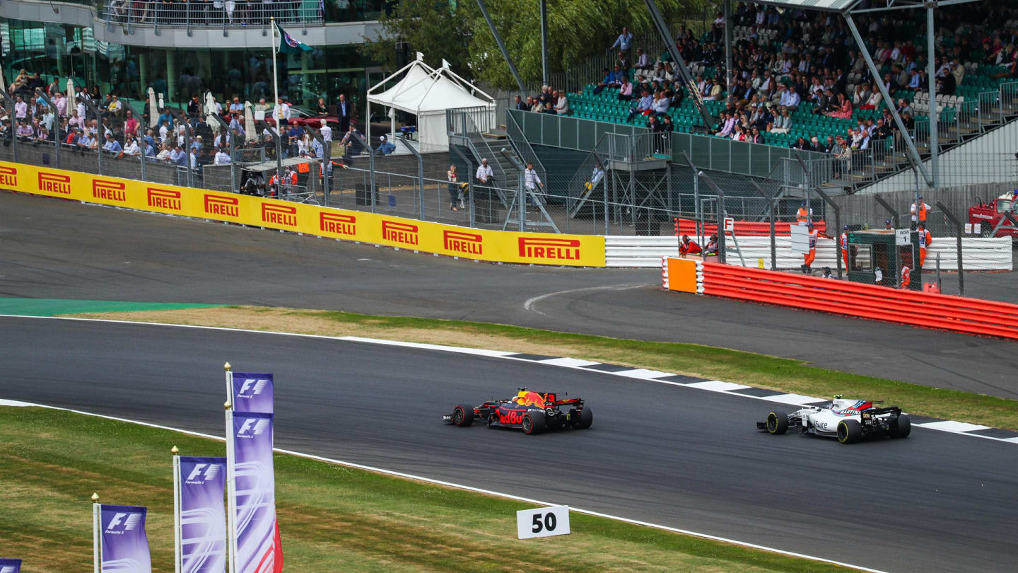 Daniel Ricciardo (AUS) Red Bull Racing RB13 and Lance Stroll (CDN) Williams FW40 at Formula One
