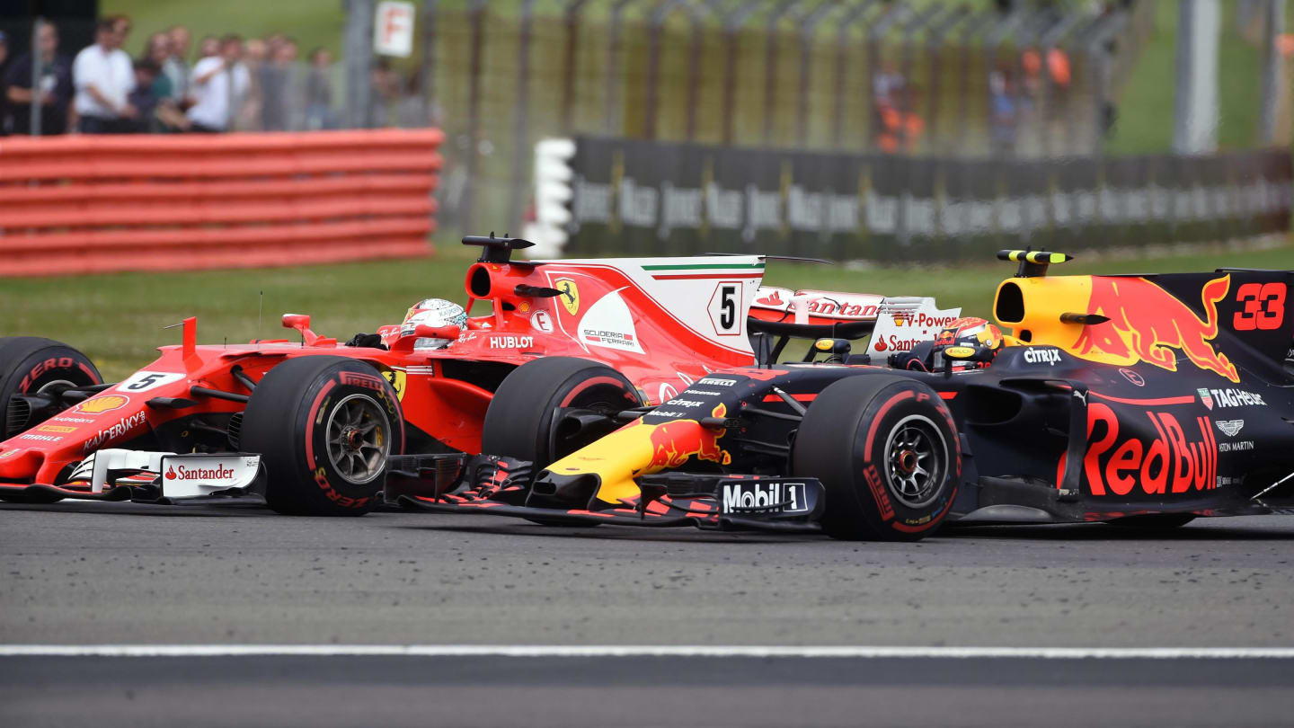 Sebastian Vettel (GER) Ferrari SF70-H and Max Verstappen (NED) Red Bull Racing RB13 battle for