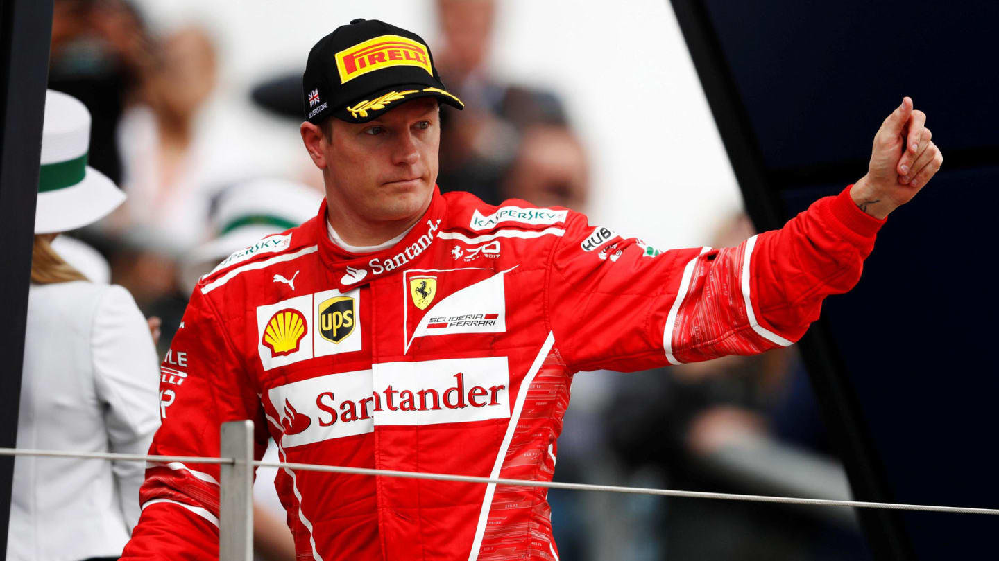 Kimi Raikkonen (FIN) Ferrari celebrates on the podium at Formula One World Championship, Rd10,