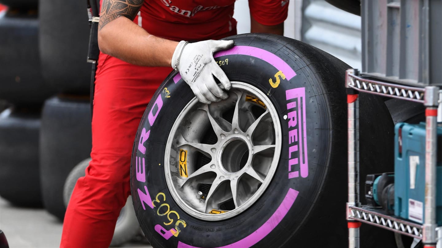 Ferrari mechanic with Pirelli tyre at Formula One World Championship, Rd7, Canadian Grand Prix,
