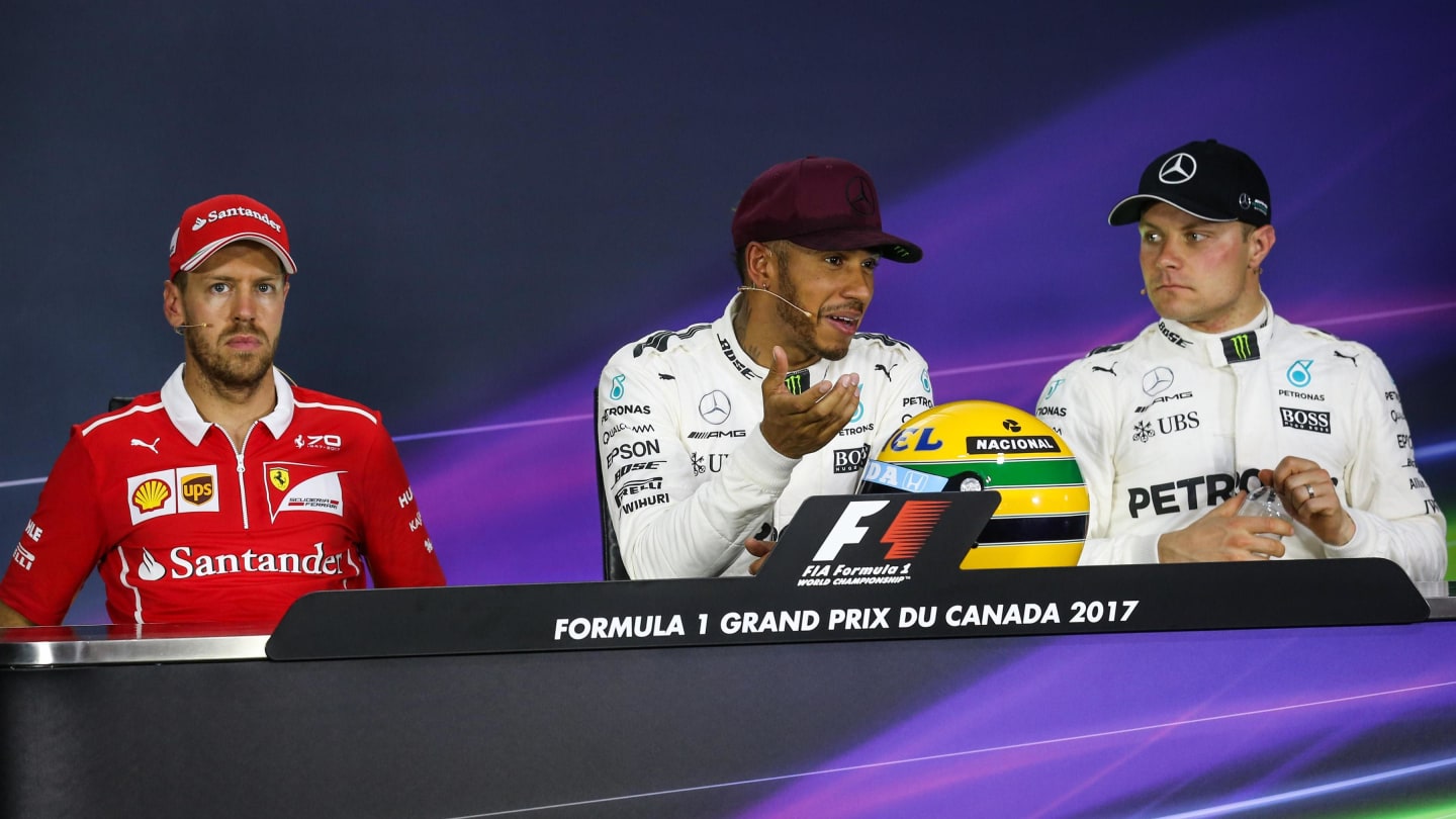 Sebastian Vettel (GER) Ferrari, pole sitter Lewis Hamilton (GBR) Mercedes AMG F1 and Valtteri