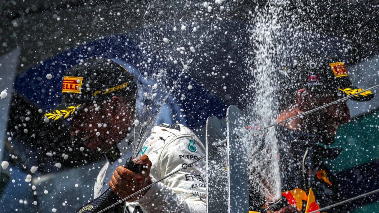 Race winner Lewis Hamilton (GBR) Mercedes AMG F1 celebrates on the podium with the champagne and Daniel Ricciardo (AUS) Red Bull Racing at Formula One World Championship, Rd7, Canadian Grand Prix, Race, Montreal, Canada, Sunday 11 June 2017. © Sutton Motorsport Images