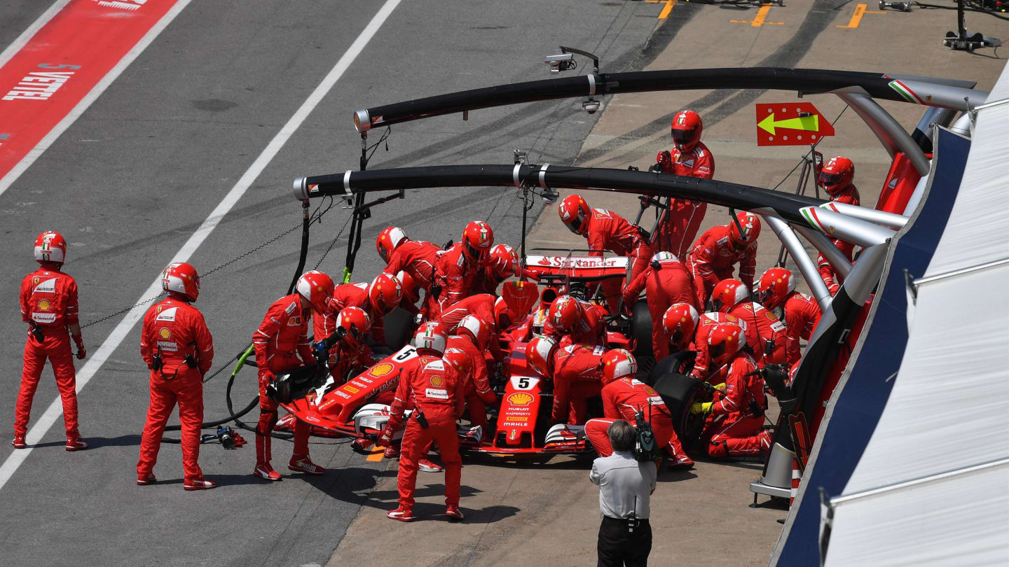 Sebastian Vettel (GER) Ferrari SF70-H makes a pit stop with a dmaged front wing at Formula One