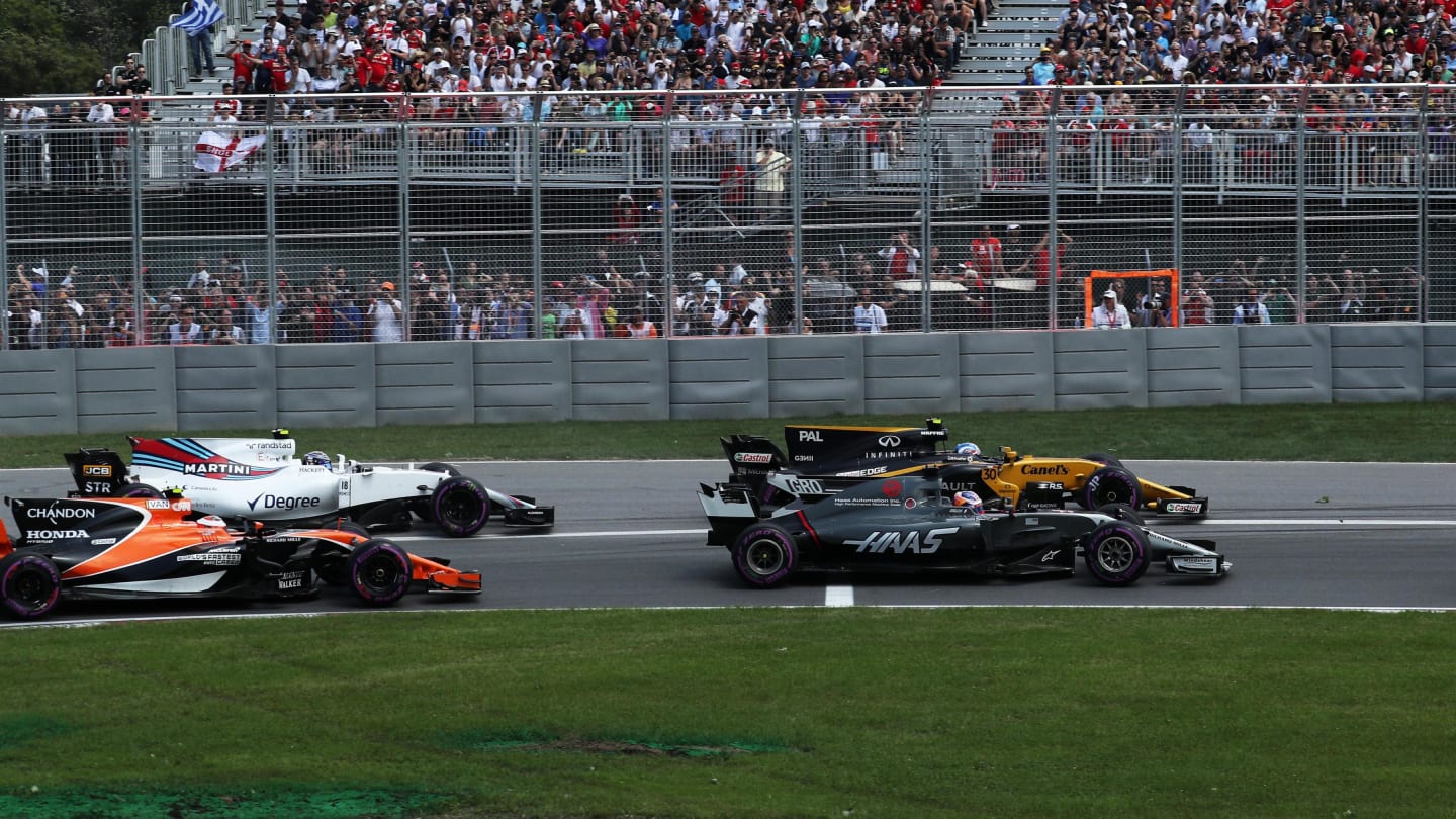 Romain Grosjean (FRA) Haas VF-17, Jolyon Palmer (GBR) Renault Sport F1 Team RS17, Stoffel Vandoorne (BEL) McLaren MCL32 and Lewis Hamilton (GBR) Mercedes-Benz F1 W08 Hybrid at the start of the race at Formula One World Championship, Rd7, Canadian Grand Prix, Race, Montreal, Canada, Sunday 11 June 2017. © Sutton Images