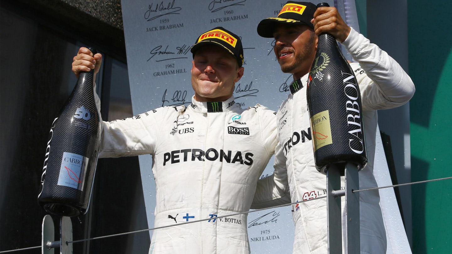 Valtteri Bottas (FIN) Mercedes AMG F1 and Lewis Hamilton (GBR) Mercedes AMG F1 celebrate on the podium with the champagne at Formula One World Championship, Rd7, Canadian Grand Prix, Race, Montreal, Canada, Sunday 11 June 2017.