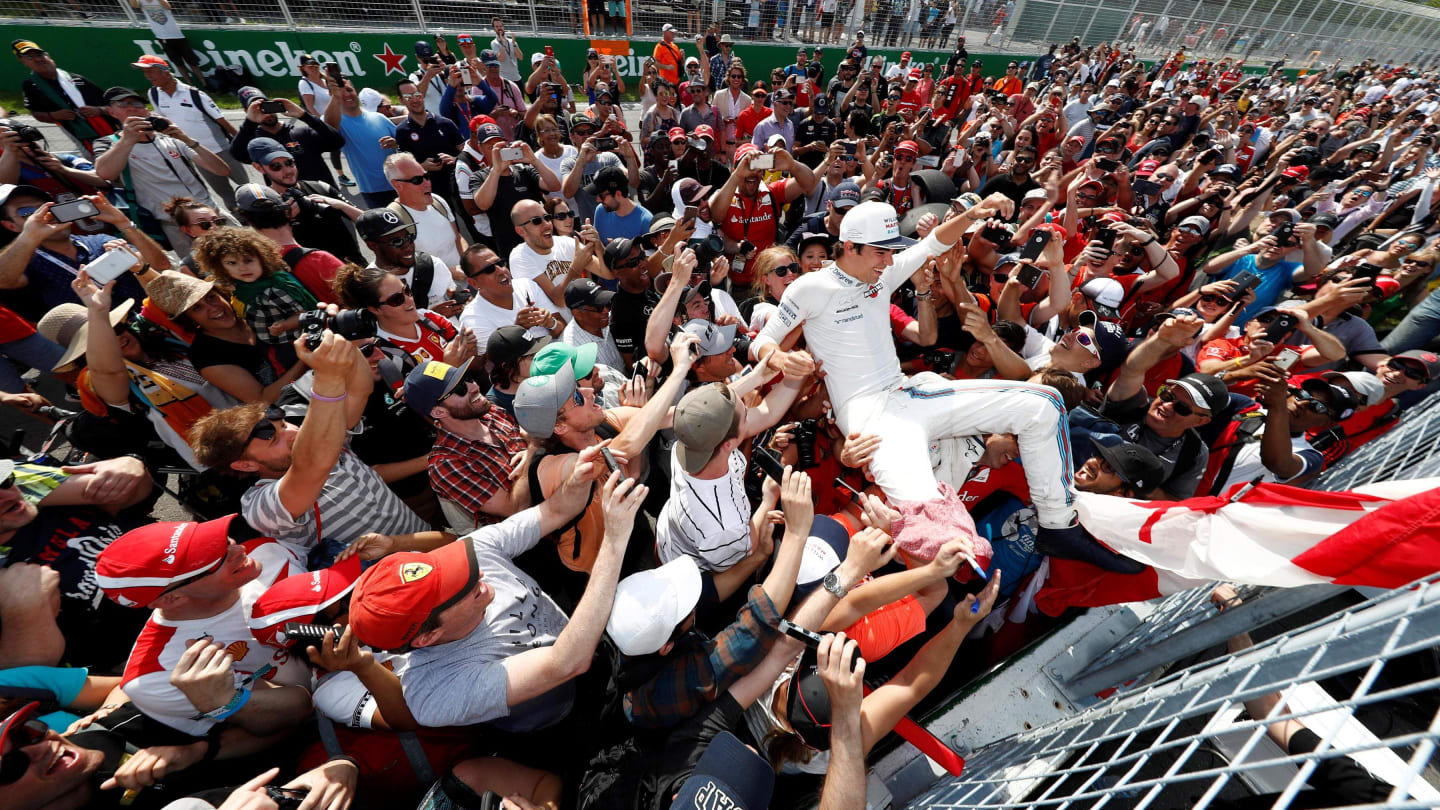 Ninth place finisher Lance Stroll (CDN) Williams celebrates with the fans at Formula One World