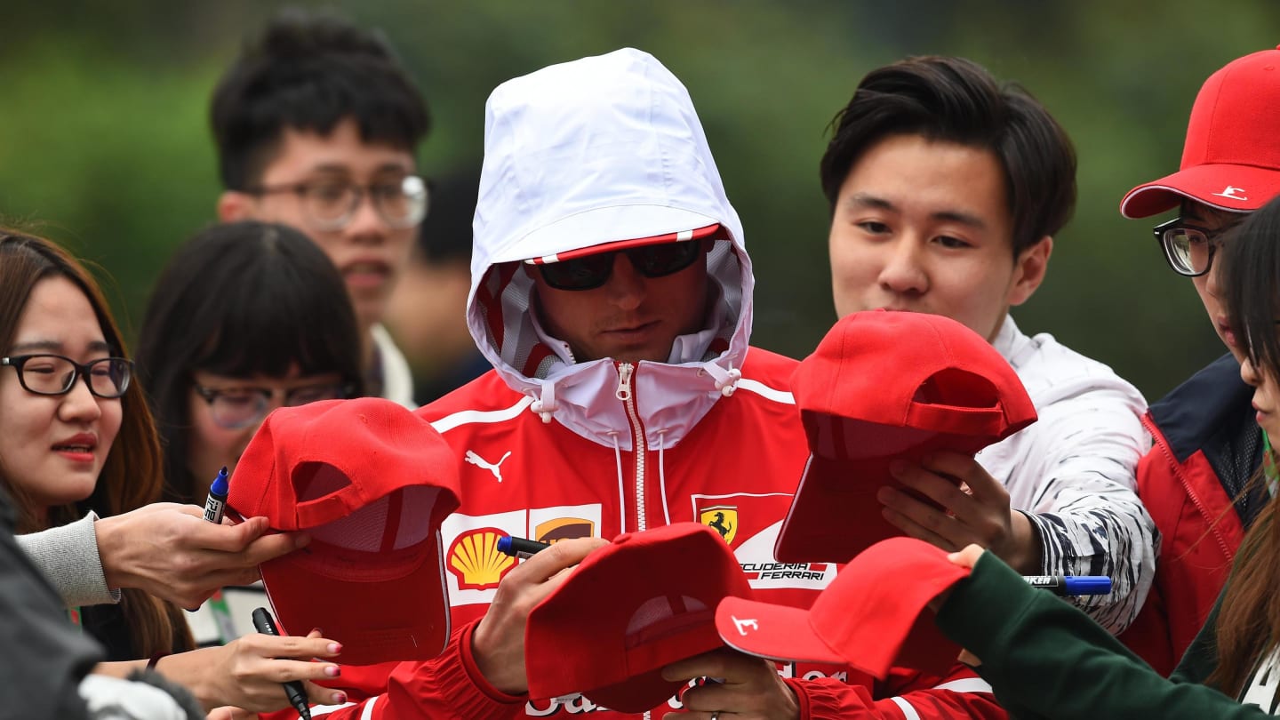 Kimi Raikkonen (FIN) Ferrari signs autographs for the fans at Formula One World Championship, Rd2, Chinese Grand Prix, Practice, Shanghai, China, Friday 7 April 2017. © Sutton Motorsport Images