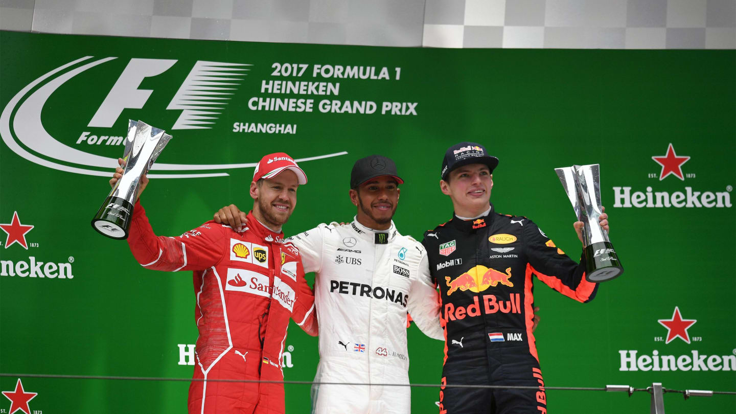 (L to R): Vettel Ferrari, Hamilton Mercedes AMG F1 and Verstappen Red Bull Racing celebrate on the podium with the trophies at Formula One World Championship, Rd2, Chinese Grand Prix, Race, Shanghai, China, Sunday 9 April 2017. © Sutton Motorsport Images