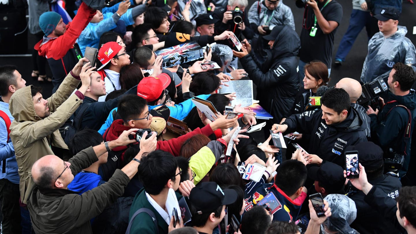 Esteban Ocon (FRA) Force India F1 and Lewis Hamilton (GBR) Mercedes AMG F1 sign autographs for the fans at Formula One World Championship, Rd2, Chinese Grand Prix, Preparations, Shanghai, China, Thursday 6 April 2017. © Sutton Motorsport Images
