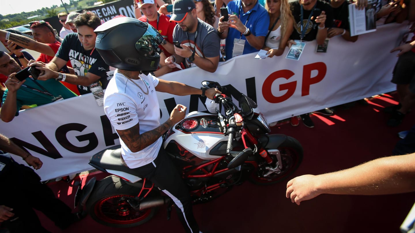 Lewis Hamilton (GBR) Mercedes AMG F1 on his MV Agusta Dragster RR LH44 Limited Edition motorbike with the fans at Formula One World Championship, Rd11, Hungarian Grand Prix, Qualifying, Hungaroring, Hungary, Saturday 29 July 2017. © Sutton Images
