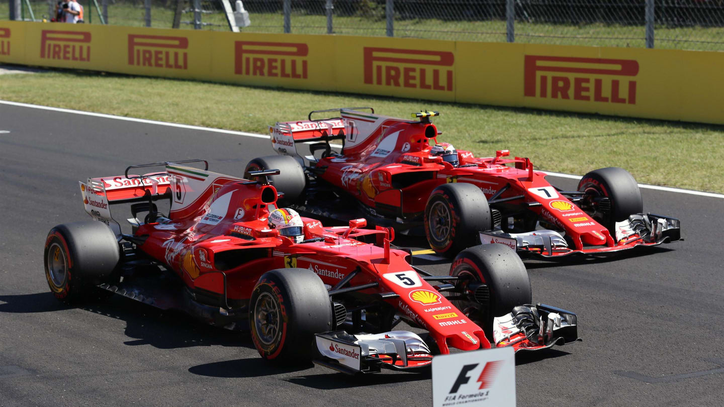 Pole sitter Sebastian Vettel (GER) Ferrari SF70-H and Kimi Raikkonen (FIN) Ferrari SF70-H in parc ferme at Formula One World Championship, Rd11, Hungarian Grand Prix, Qualifying, Hungaroring, Hungary, Saturday 29 July 2017. © Sutton Images