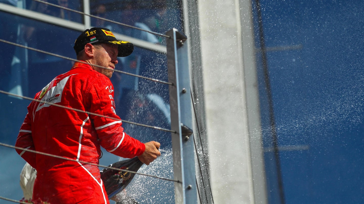 Race winner Sebastian Vettel (GER) Ferrari celebrates on the podium with the champagne at Formula One World Championship, Rd11, Hungarian Grand Prix, Race, Hungaroring, Hungary, Sunday 30 July 2017. © Sutton Images