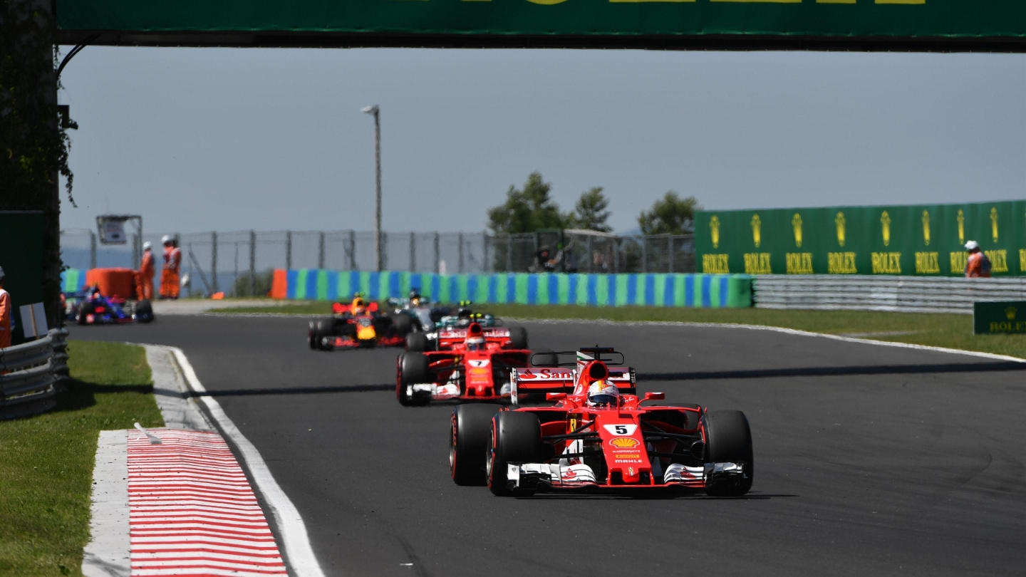 Sebastian Vettel (GER) Ferrari SF70-H leads at the start of the race at Formula One World