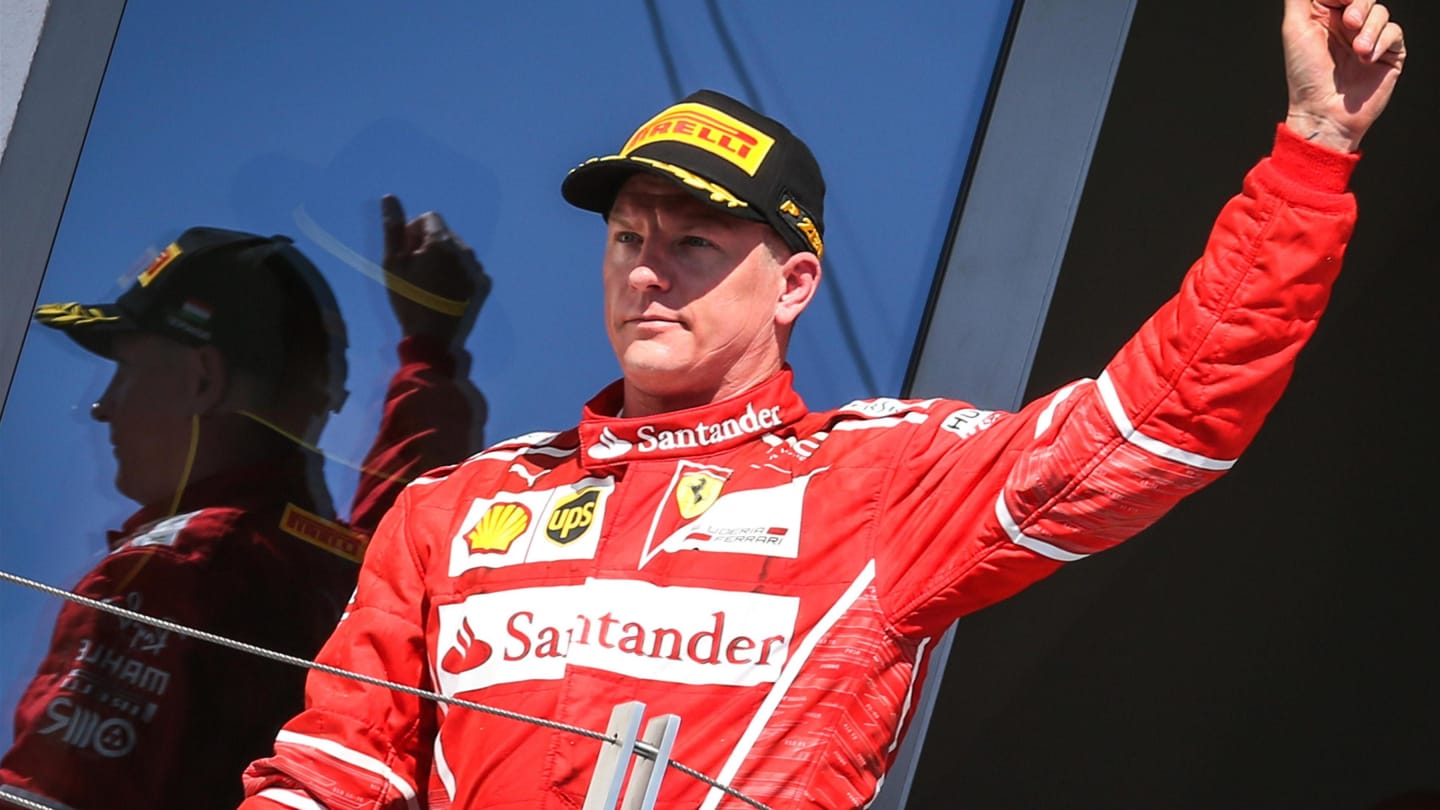 Kimi Raikkonen (FIN) Ferrari celebrates on the podium at Formula One World Championship, Rd11,