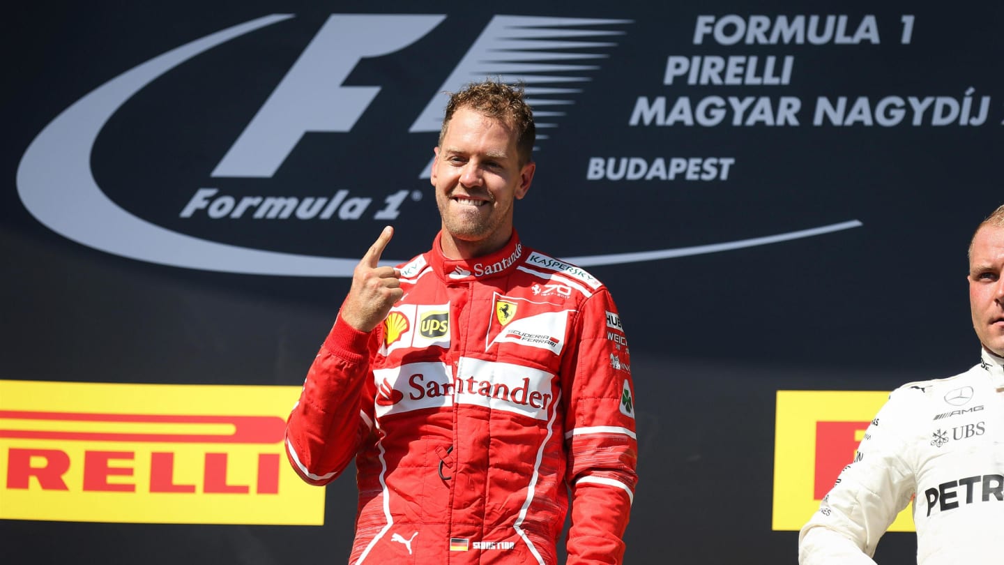 Race winner Sebastian Vettel (GER) Ferrari celebrates on the podium at Formula One World Championship, Rd11, Hungarian Grand Prix, Race, Hungaroring, Hungary, Sunday 30 July 2017. © Sutton Images