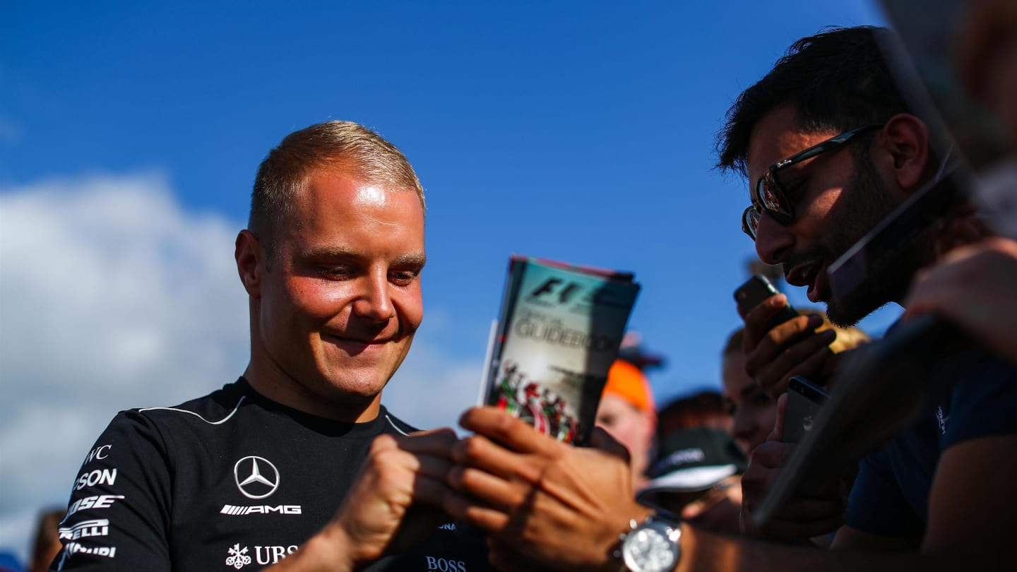 Valtteri Bottas (FIN) Mercedes AMG F1 signs autographs for the fans at the autograph session at