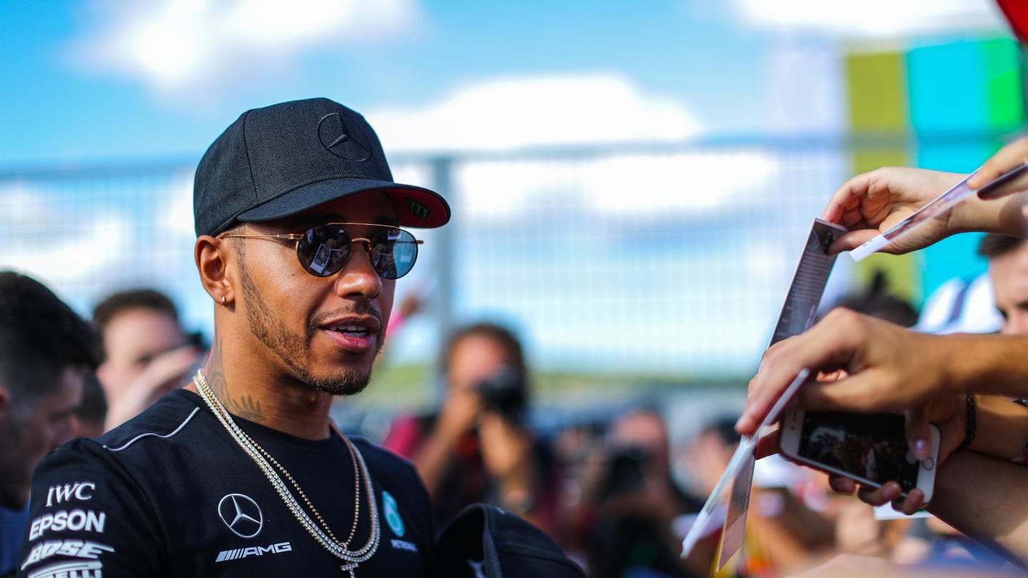 Lewis Hamilton (GBR) Mercedes AMG F1 signs autographs for the fans at the autograph session at
