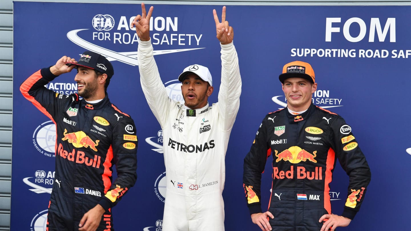 (L to R): Daniel Ricciardo (AUS) Red Bull Racing, pole sitter Lewis Hamilton (GBR) Mercedes AMG F1 and Max Verstappen (NED) Red Bull Racing celebrate in parc ferme at Formula One World Championship, Rd13, Italian Grand Prix, Qualifying, Monza, Italy, Satu