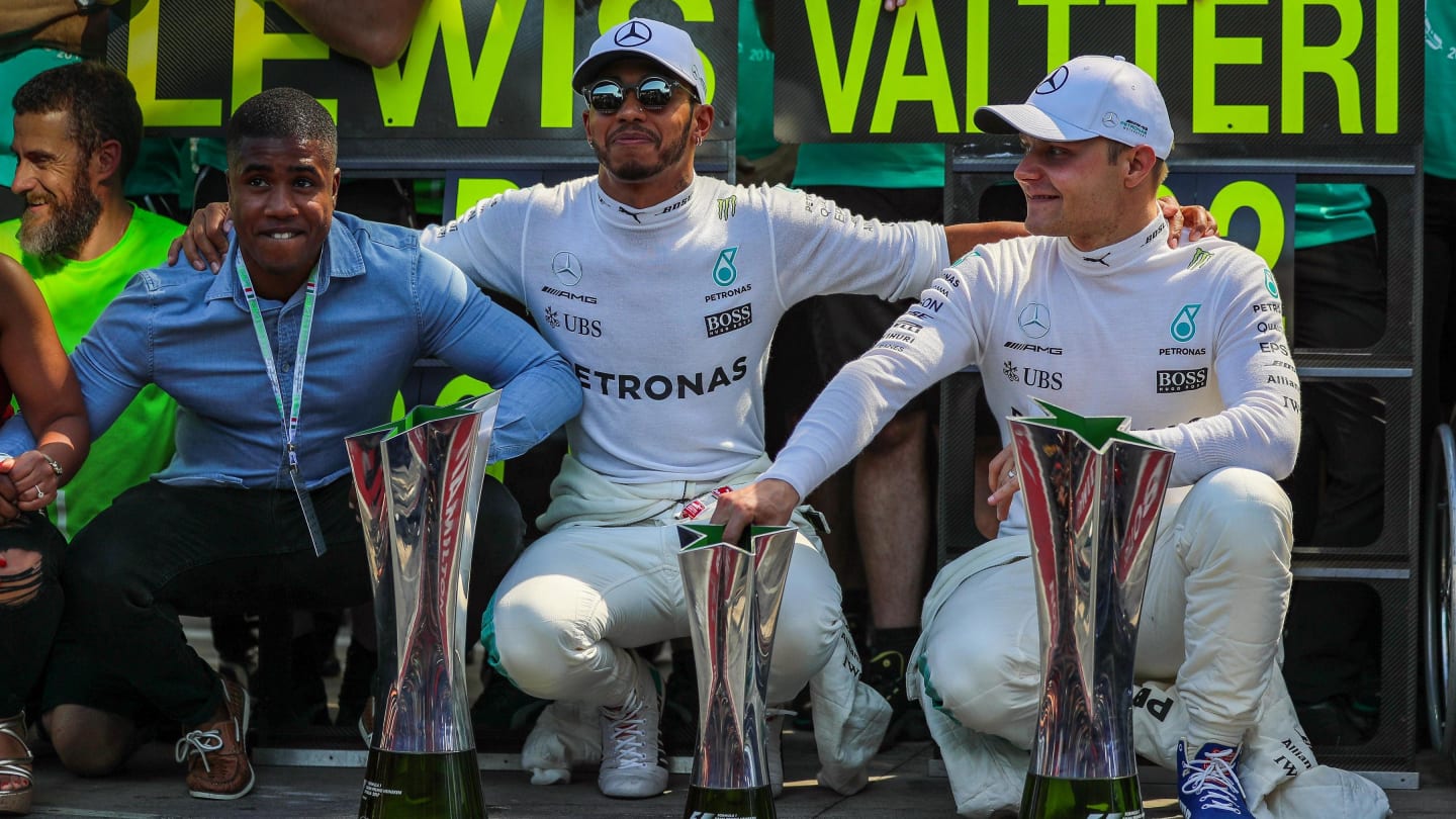 Race winner Lewis Hamilton (GBR) Mercedes AMG F1 and Valtteri Bottas (FIN) Mercedes AMG F1 celebrate with the team and the trophies at Formula One World Championship, Rd13, Italian Grand Prix, Race, Monza, Italy, Sunday 3 September 2017. © Sutton Images