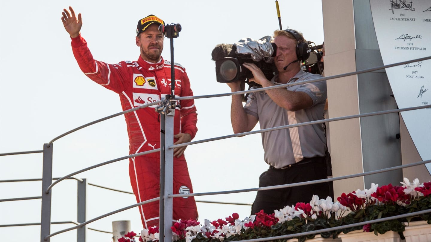 Sebastian Vettel (GER) Ferrari celebrates on the podium at Formula One World Championship, Rd13,