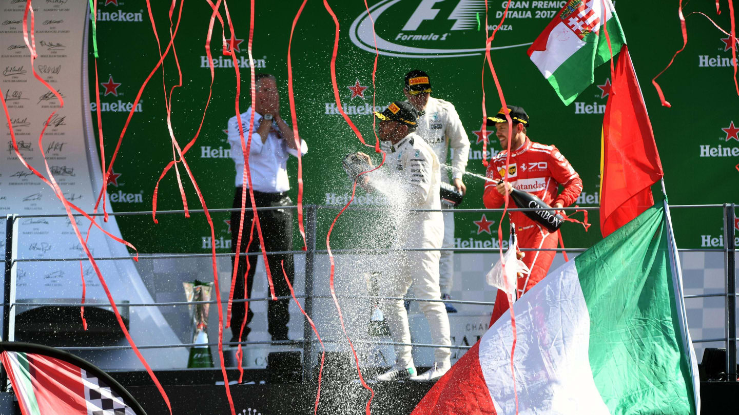 Bottas (FIN) Mercedes AMG F1, Hamilton (GBR) Mercedes AMG F1 and Vettel (GER) Ferrari celebrate on the podium with the champagne at Formula One World Championship, Rd13, Italian Grand Prix, Race, Monza, Italy, Sunday 3 September 2017. © Sutton Images