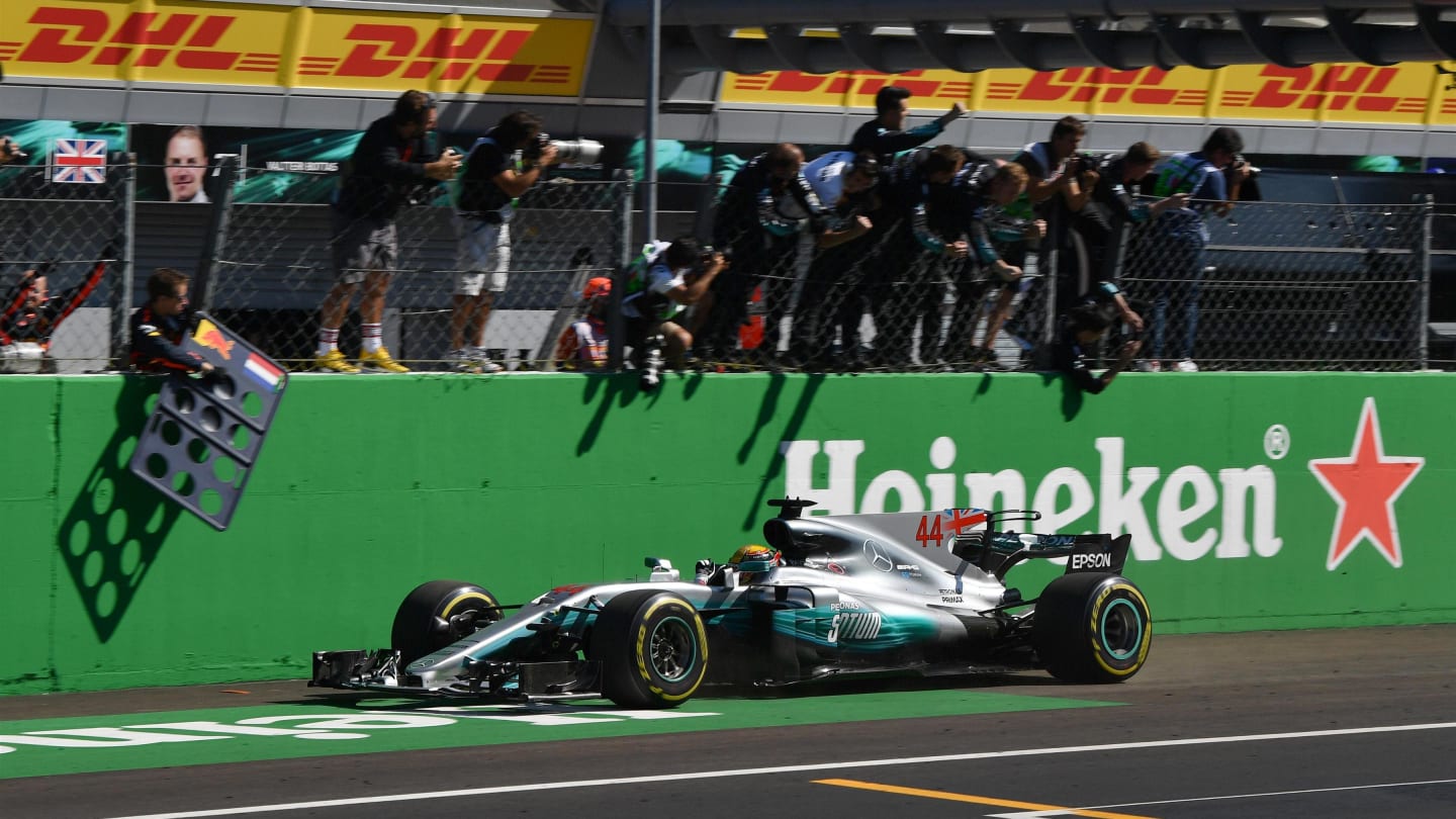 Race winner Lewis Hamilton (GBR) Mercedes-Benz F1 W08 Hybrid crosses the line at Formula One World