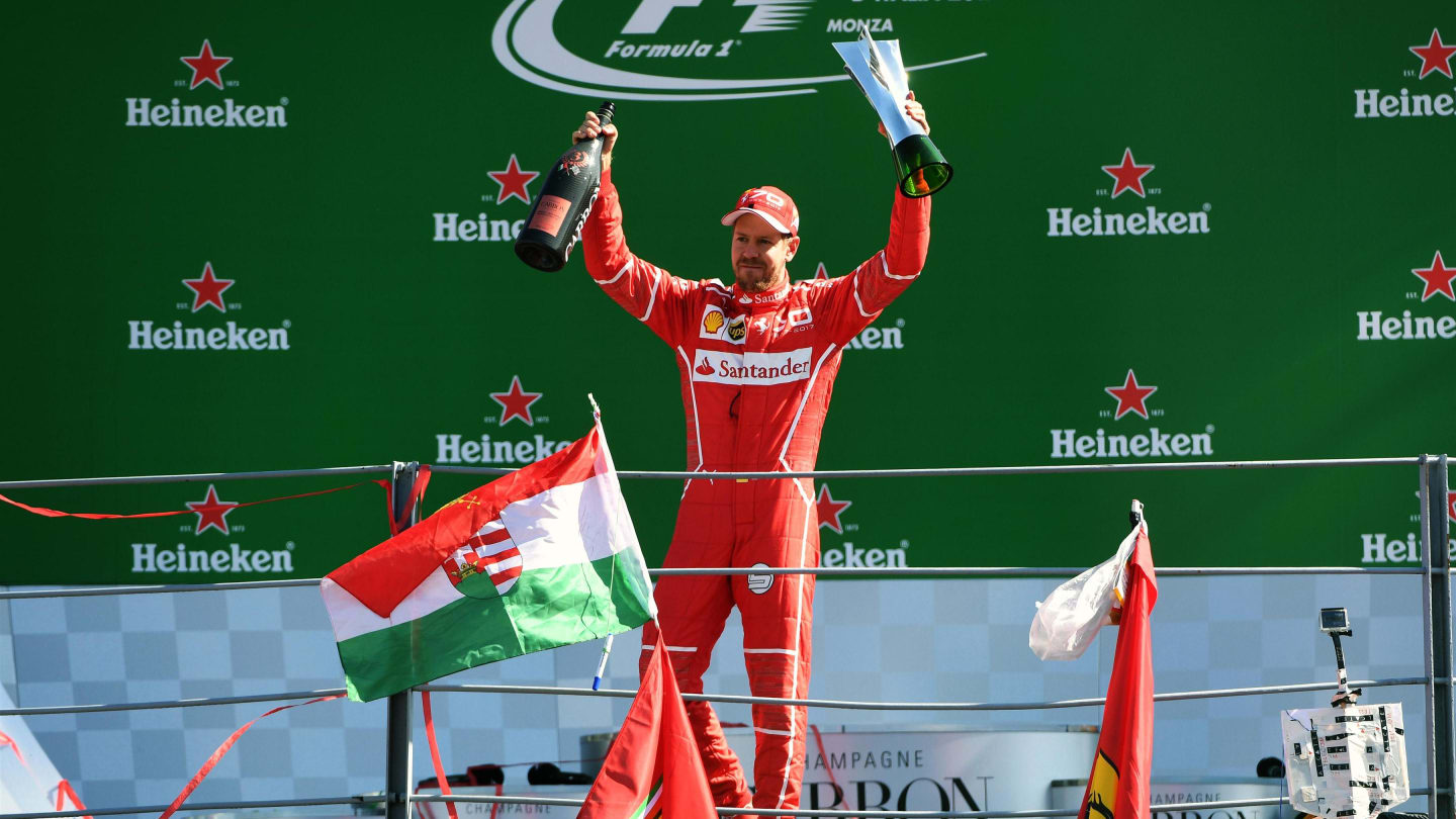 Sebastian Vettel (GER) Ferrari celebrates on the podium with the trophy at Formula One World Championship, Rd13, Italian Grand Prix, Race, Monza, Italy, Sunday 3 September 2017. © Sutton Images
