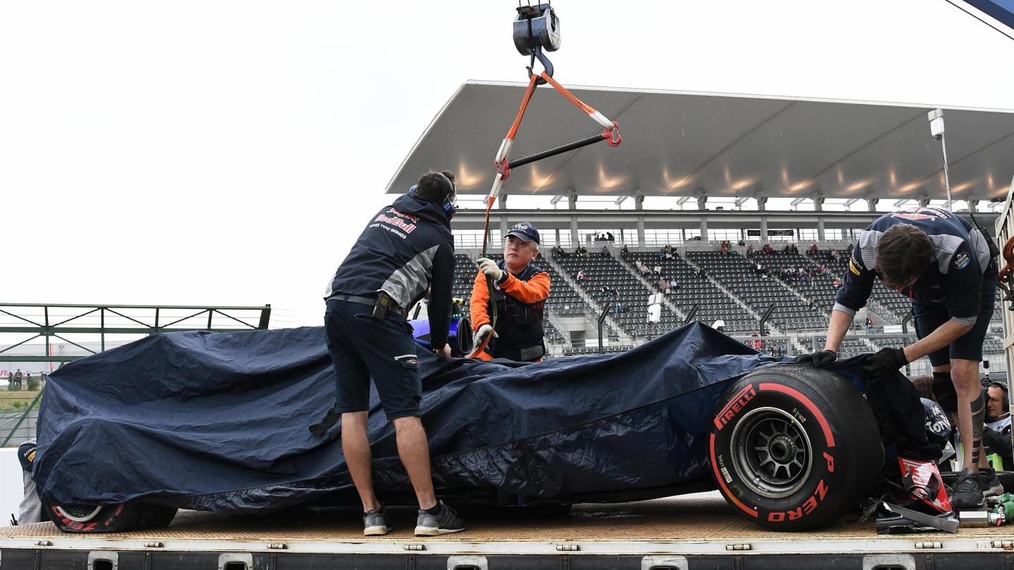 The crashed car of Carlos Sainz (ESP) Scuderia Toro Rosso STR12 is recovered after FP1 at Formula One World Championship, Rd16, Japanese Grand Prix, Practice, Suzuka, Japan, Friday 6 October 2017. © Rubio/Sutton Images