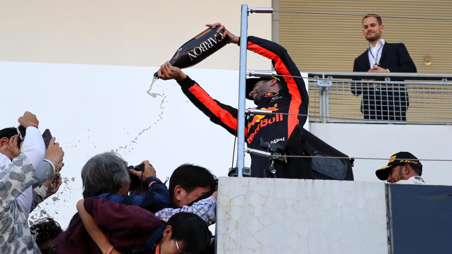 Daniel Ricciardo (AUS) Red Bull Racing celebrates on the podium with the champagne and the fans and photographers at Formula One World Championship, Rd16, Japanese Grand Prix, Race, Suzuka, Japan, Sunday 8 October 2017. © Kym Illman/Sutton Images