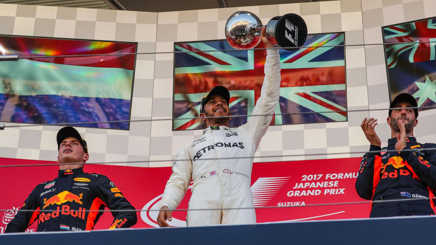 Race winner Lewis Hamilton (GBR) Mercedes AMG F1 celebrates on the podium with the trophy at