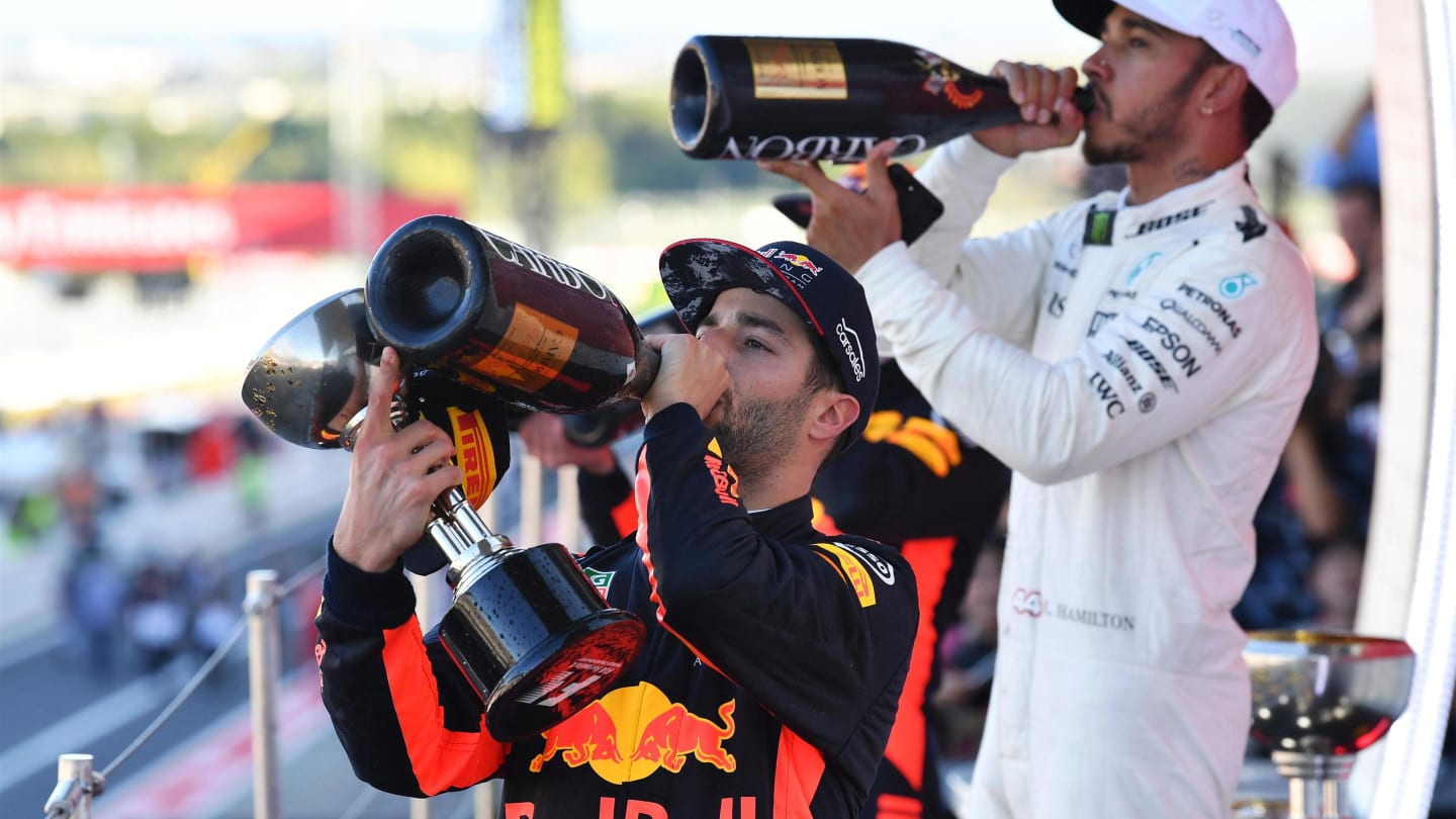 Daniel Ricciardo (AUS) Red Bull Racing and Lewis Hamilton (GBR) Mercedes AMG F1 celebrate on the podium with the champagne at Formula One World Championship, Rd16, Japanese Grand Prix, Race, Suzuka, Japan, Sunday 8 October 2017. © Mark Sutton/Sutton Images