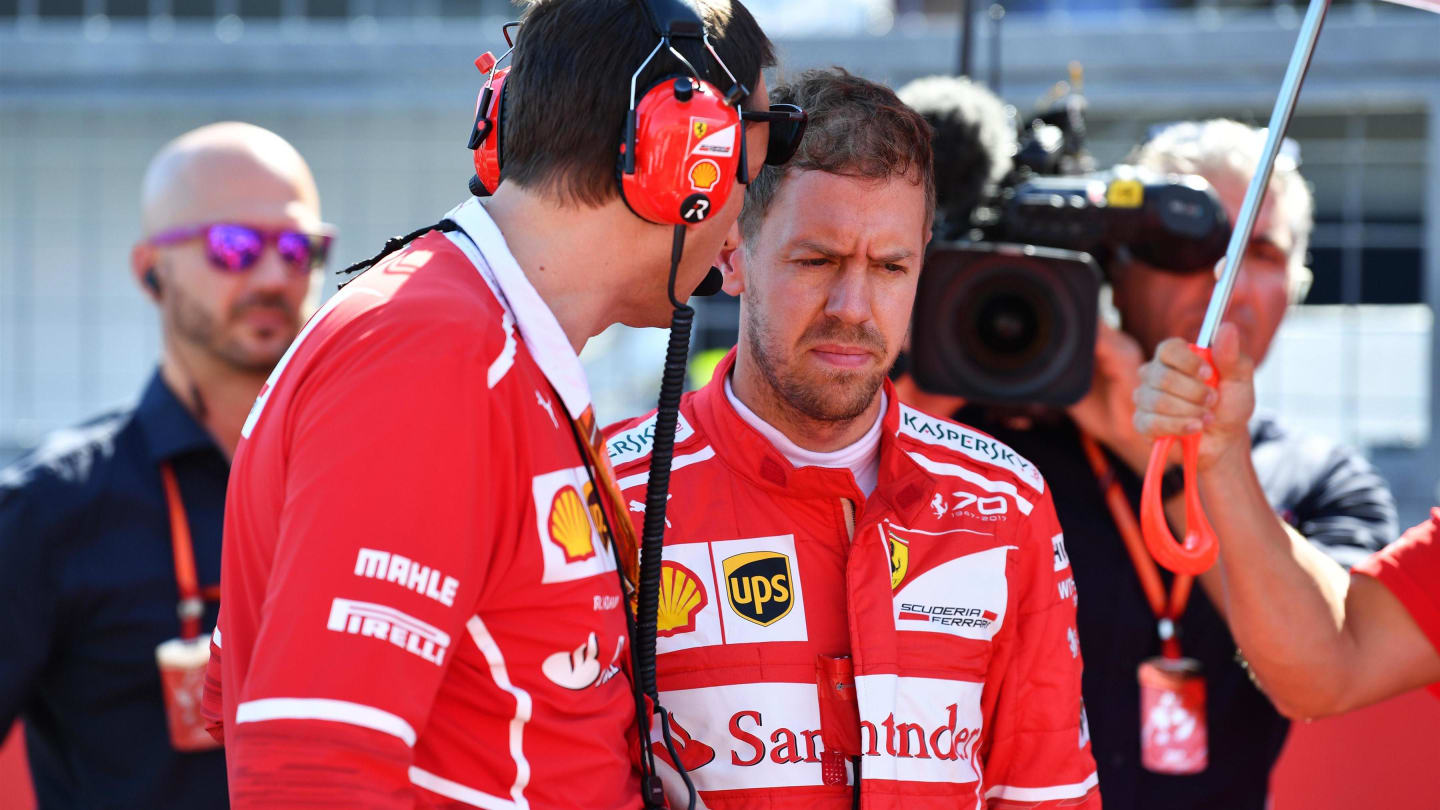 Sebastian Vettel (GER) Ferrari and Riccardo Adami (ITA) Ferrari Race Engineer on the grid at