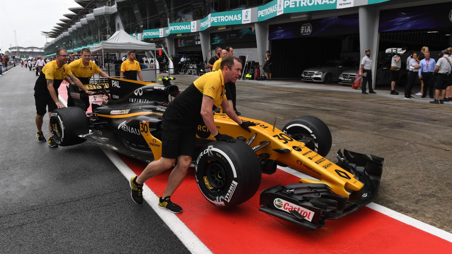 The car of Jolyon Palmer (GBR) Renault Sport F1 Team RS17 is pushed by mechanics in pitlane at Formula One World Championship, Rd15, Malaysian Grand Prix, Race, Sepang, Malaysia, Sunday 1 Octoberr 2017. © Mark Sutton/Sutton Images