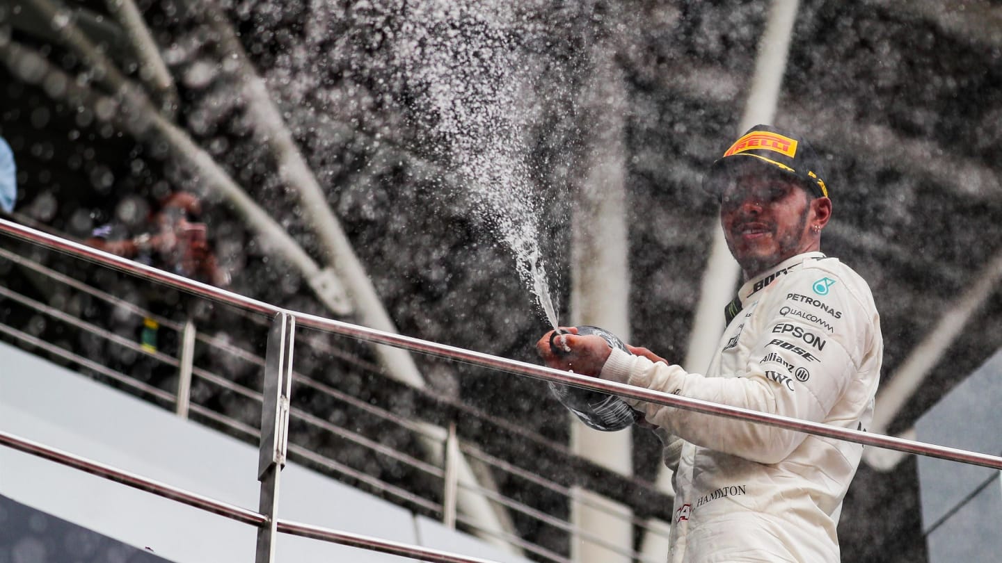 Lewis Hamilton (GBR) Mercedes AMG F1 celebrates on the podium with the champagne at Formula One World Championship, Rd15, Malaysian Grand Prix, Race, Sepang, Malaysia, Sunday 1 October 2017. © Kym Illman/Sutton Images
