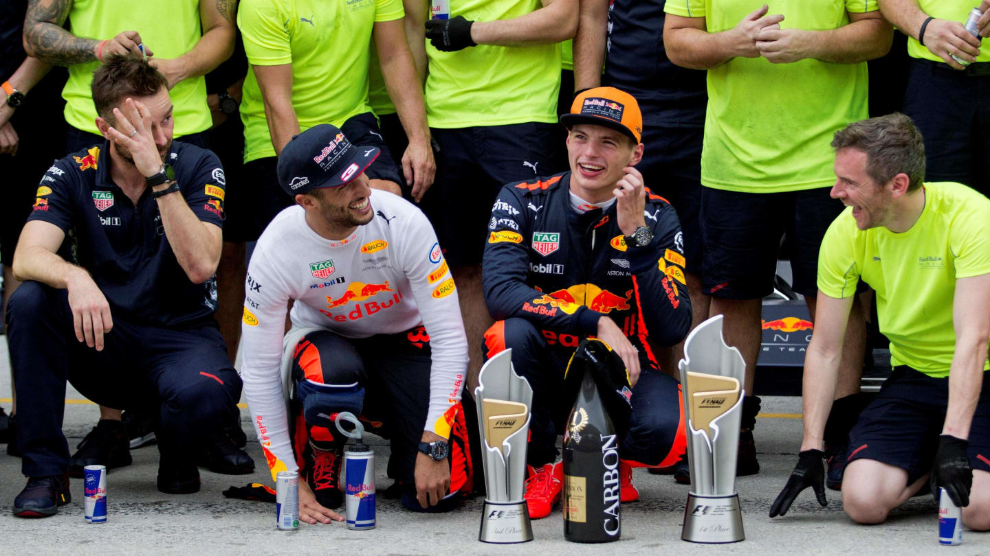 Daniel Ricciardo (AUS) Red Bull Racing and race winner Max Verstappen (NED) Red Bull Racing celebrate with the team and the trophies at Formula One World Championship, Rd15, Malaysian Grand Prix, Race, Sepang, Malaysia, Sunday 1 October 2017. © Manuel Gor