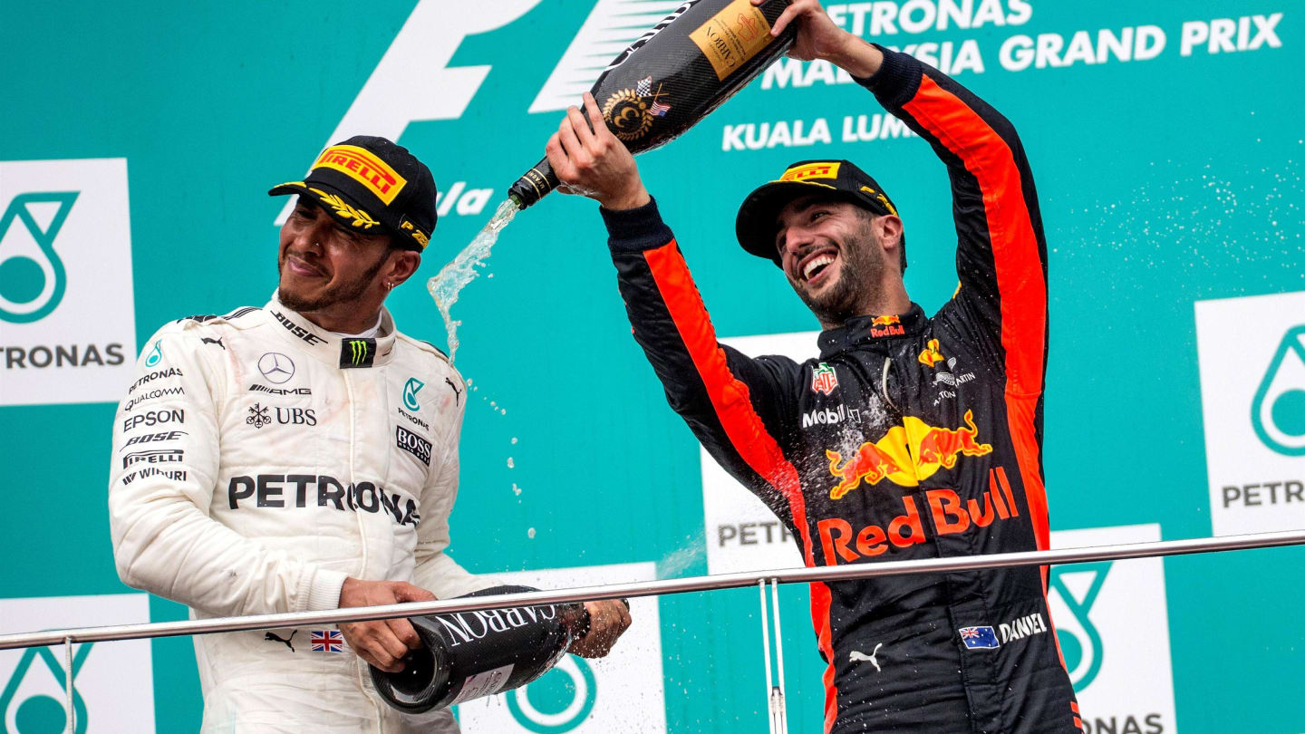 Lewis Hamilton (GBR) Mercedes AMG F1 and Daniel Ricciardo (AUS) Red Bull Racing celebrate on the