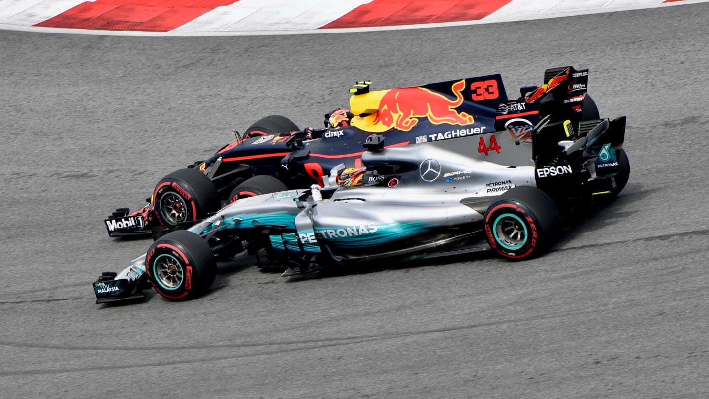 Max Verstappen (NED) Red Bull Racing RB13 passes Lewis Hamilton (GBR) Mercedes-Benz F1 W08 Hybrid