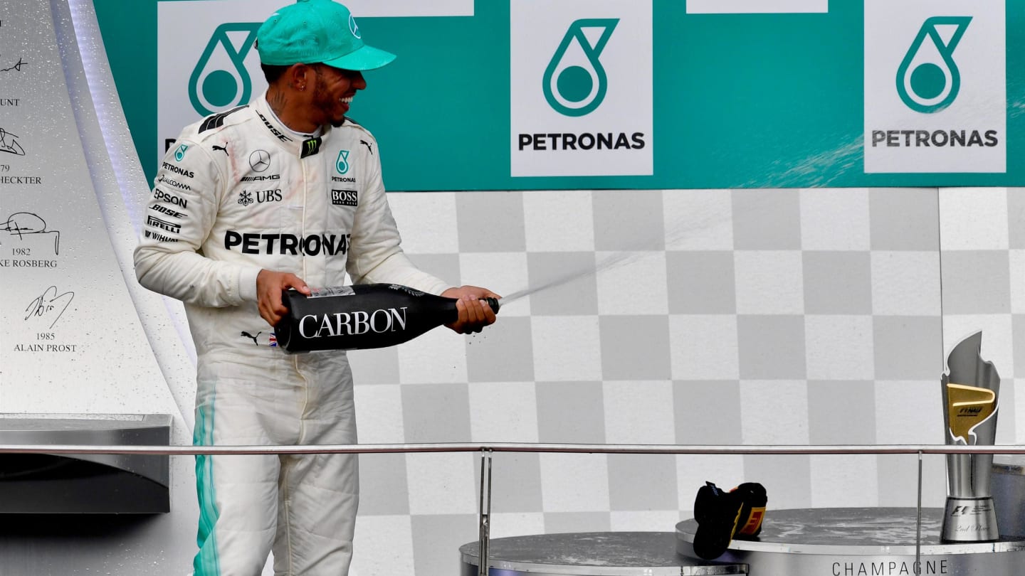 Lewis Hamilton (GBR) Mercedes AMG F1 celebrates on the podium with the champagne at Formula One