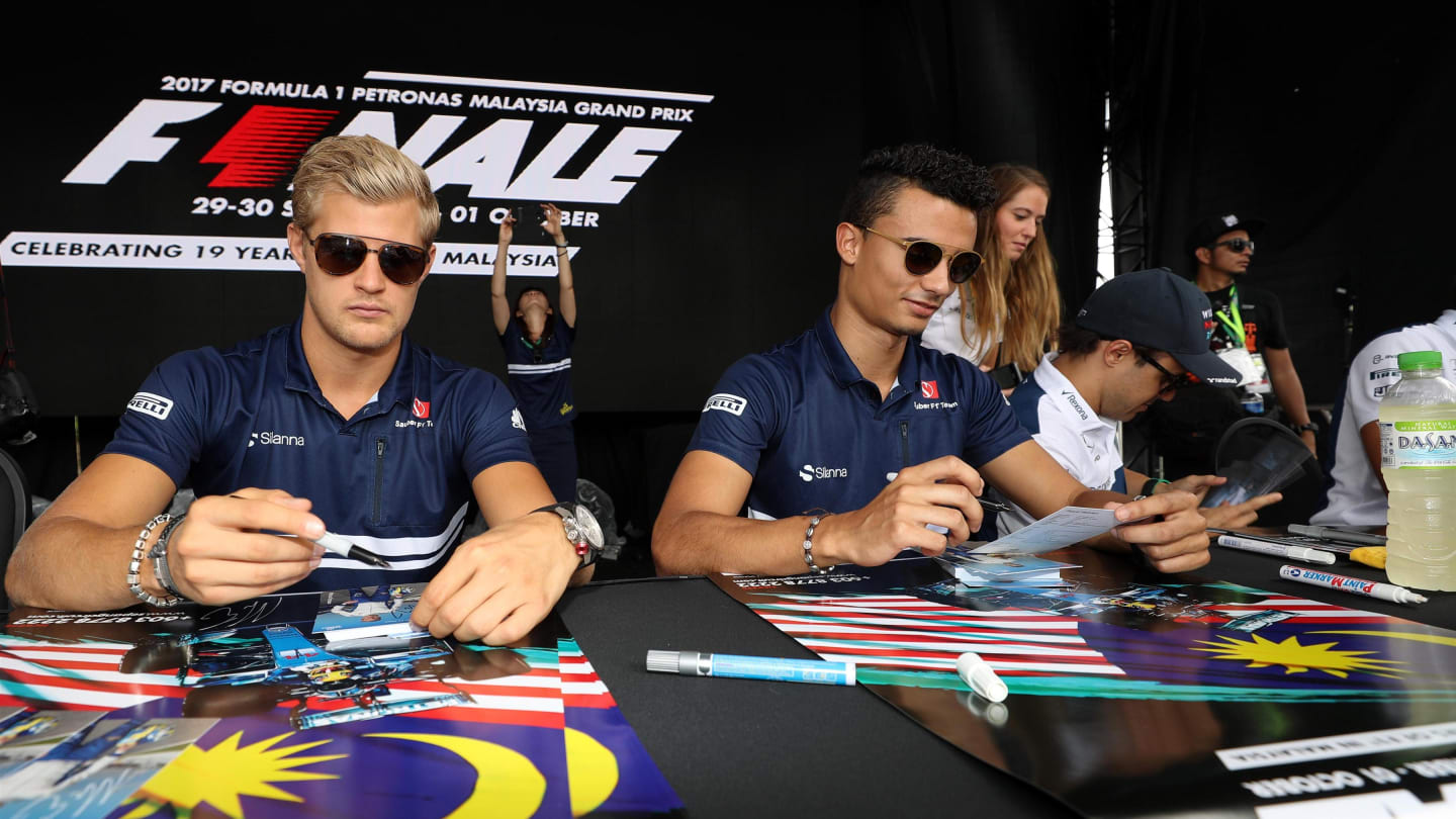 From Sunday... Marcus Ericsson (SWE) Sauber and Pascal Wehrlein (GER) Sauber sign autographs for the fans at Formula One World Championship, Rd15, Malaysian Grand Prix, Race, Sepang, Malaysia, Sunday 1 Octoberr 2017. © Kym Illman/Sutton Images