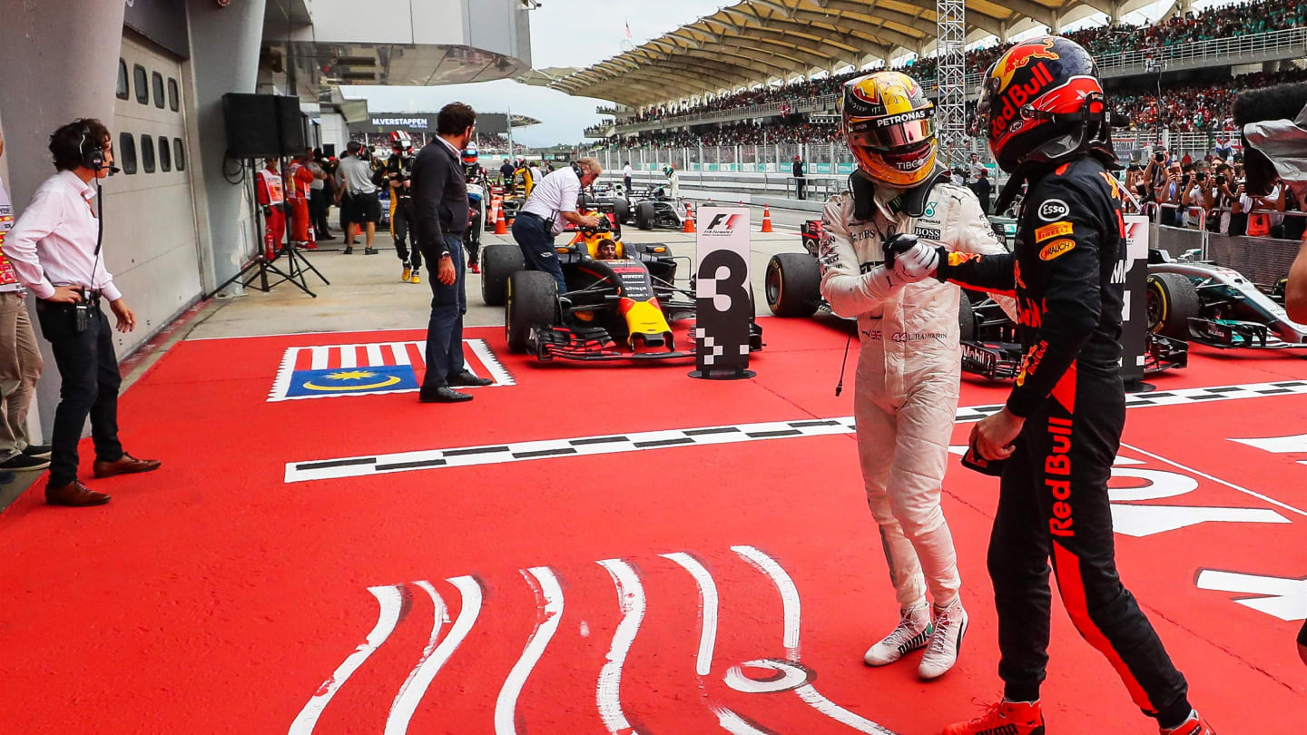 Lewis Hamilton (GBR) Mercedes AMG F1 and race winner Max Verstappen (NED) Red Bull Racing celebrate in parc ferme at Formula One World Championship, Rd15, Malaysian Grand Prix, Race, Sepang, Malaysia, Sunday 1 Octoberr 2017. © Kym Illman/Sutton Images