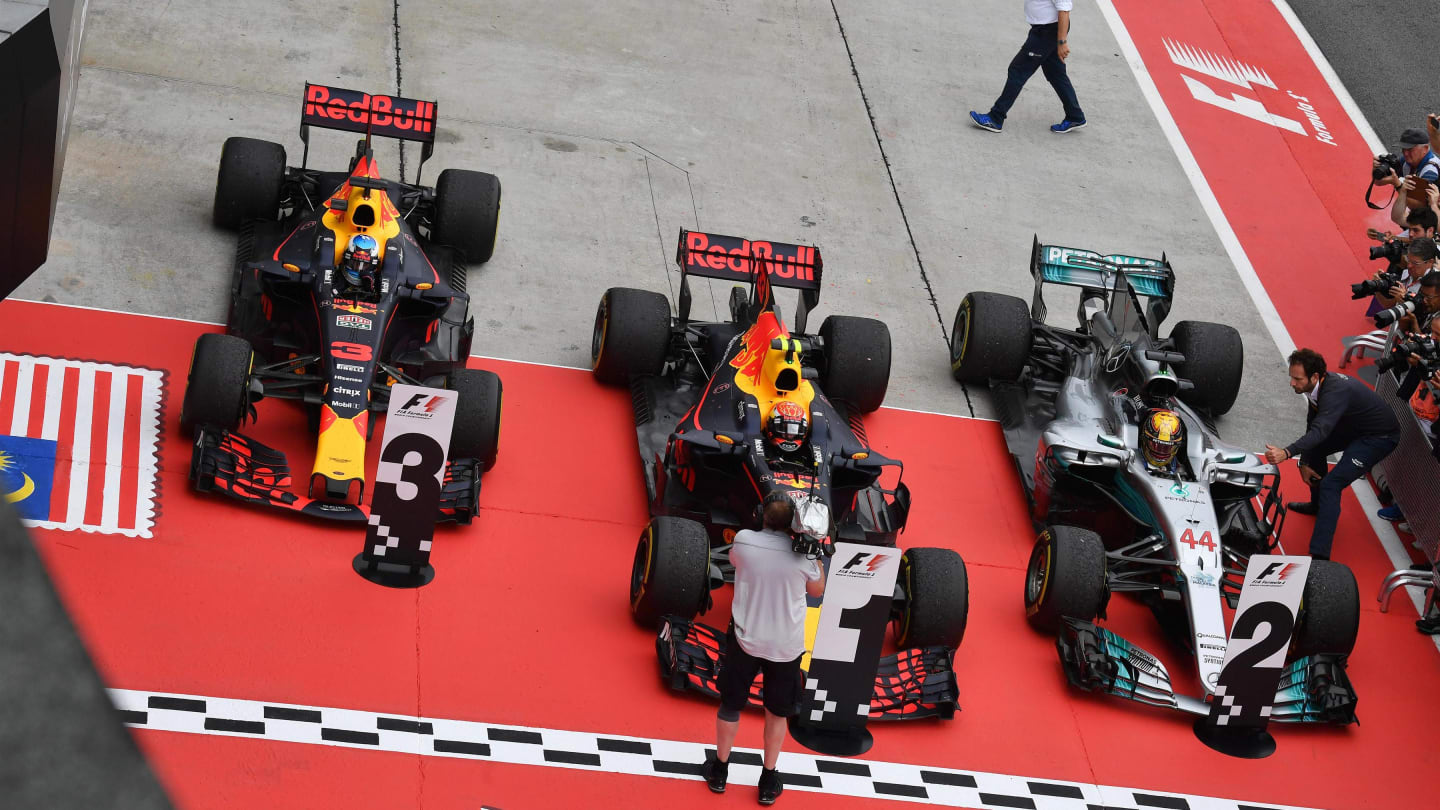 Daniel Ricciardo (AUS) Red Bull Racing RB13, Max Verstappen (NED) Red Bull Racing RB13 and Lewis Hamilton (GBR) Mercedes-Benz F1 W08 Hybrid in parc ferme at Formula One World Championship, Rd15, Malaysian Grand Prix, Race, Sepang, Malaysia, Sunday 1 October 2017. © Mark Sutton/Sutton Images