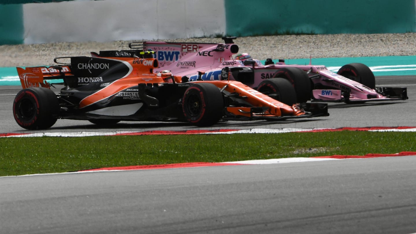 Stoffel Vandoorne (BEL) McLaren MCL32 and Sergio Perez (MEX) Force India VJM10 battle at Formula One World Championship, Rd15, Malaysian Grand Prix, Race, Sepang, Malaysia, Sunday 1 October 2017. © Mark Sutton/Sutton Images